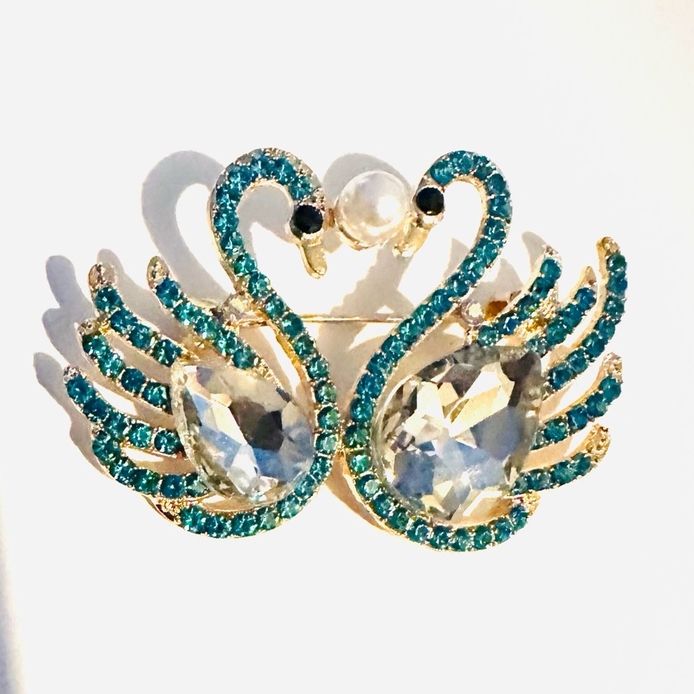 Elegant Swan Brooch with Light Blue Crystal Accents